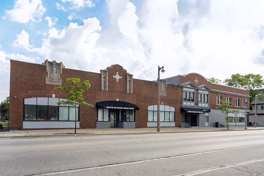 Historic brick building on a Milwaukee street, future home for community impact